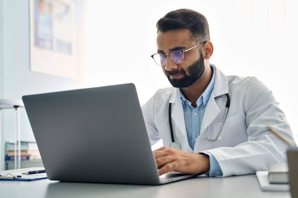 Doctor using computer for virtual training